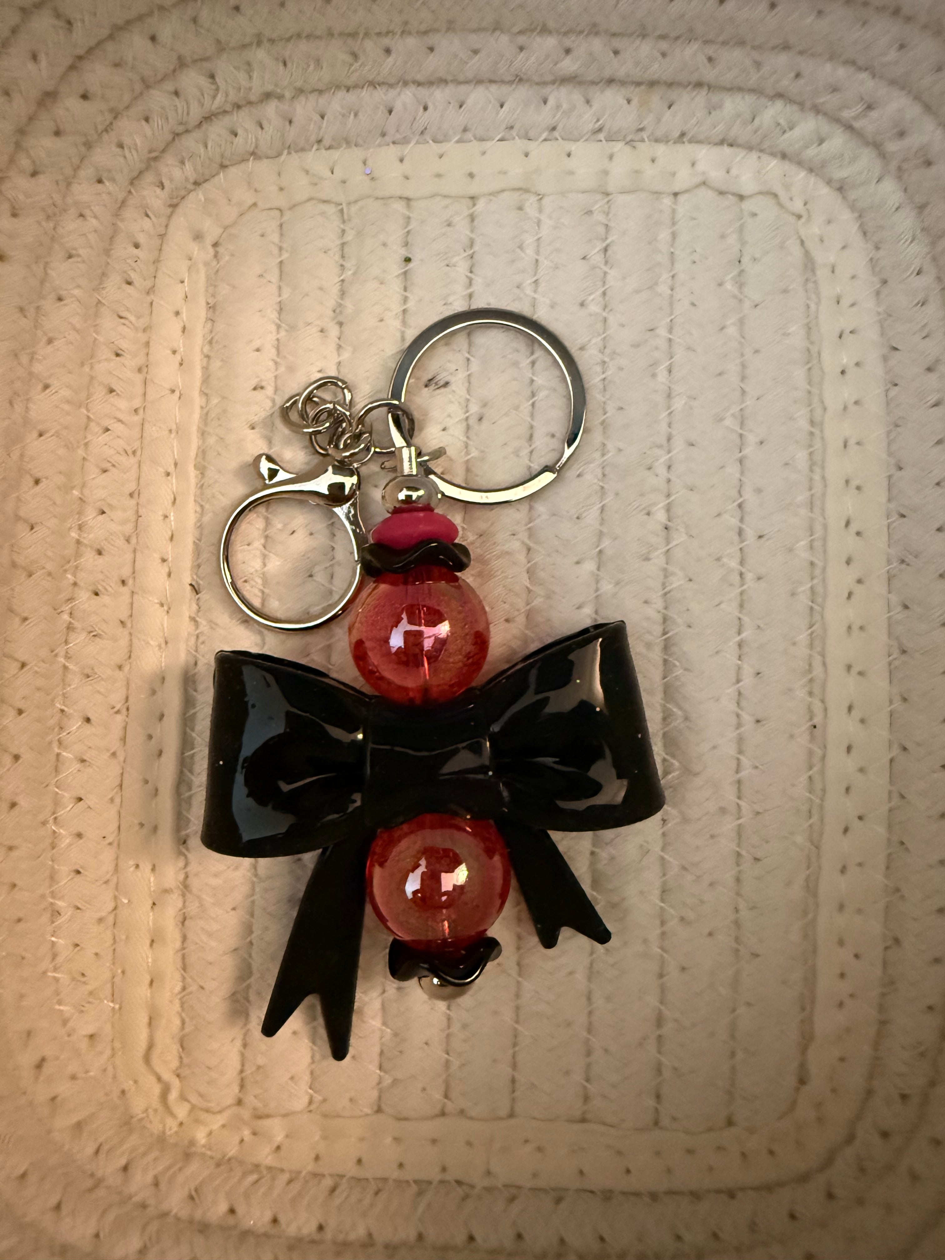 Large black bow and acrylic red bead key ring